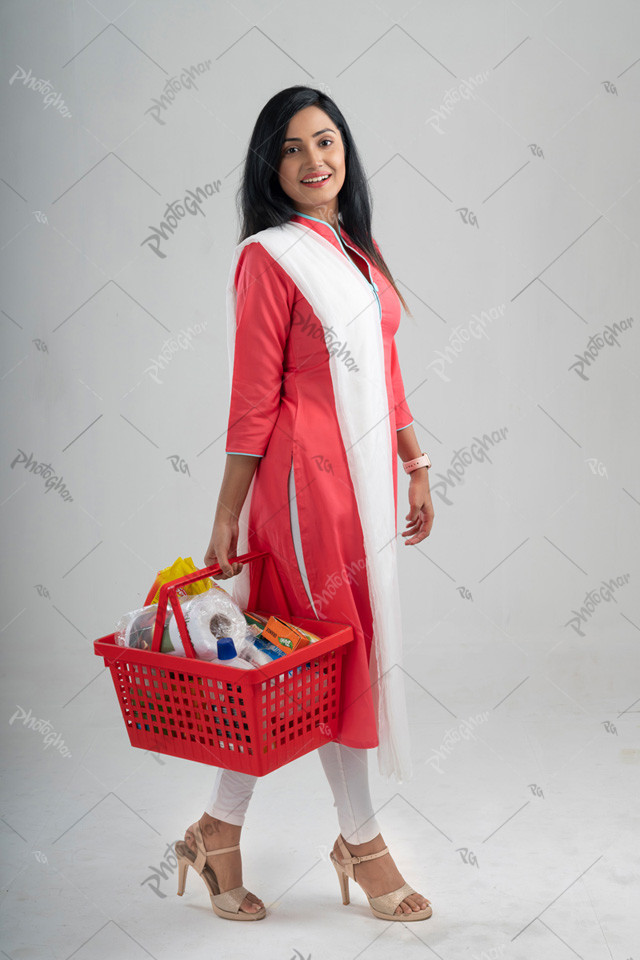 happy woman holding shopping basket