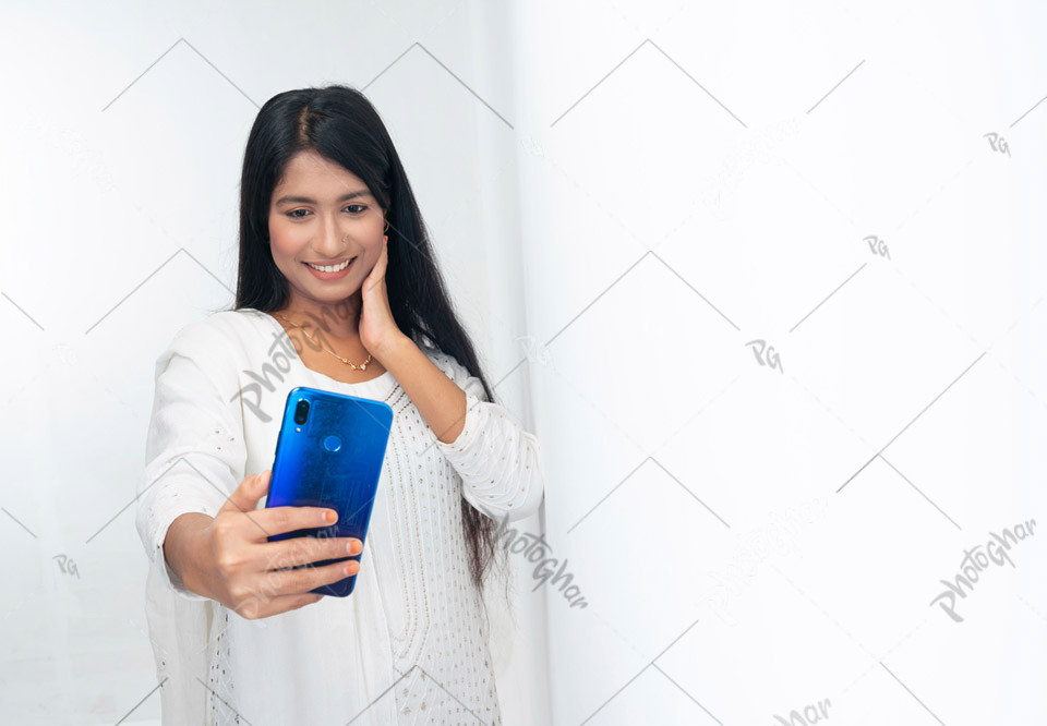 pleased smiling girl taking selfie