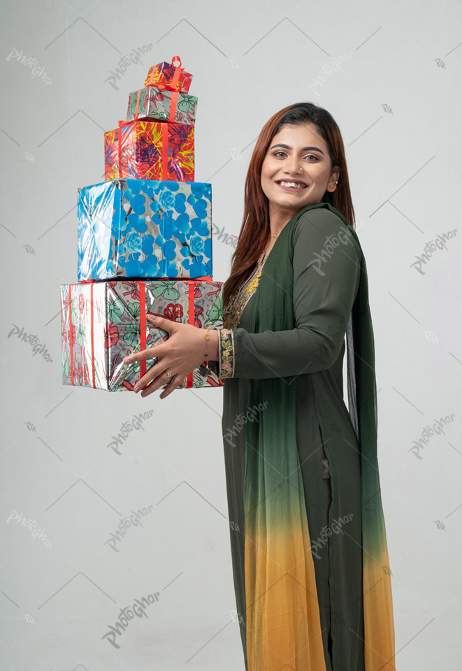 shocked woman holding gift boxes