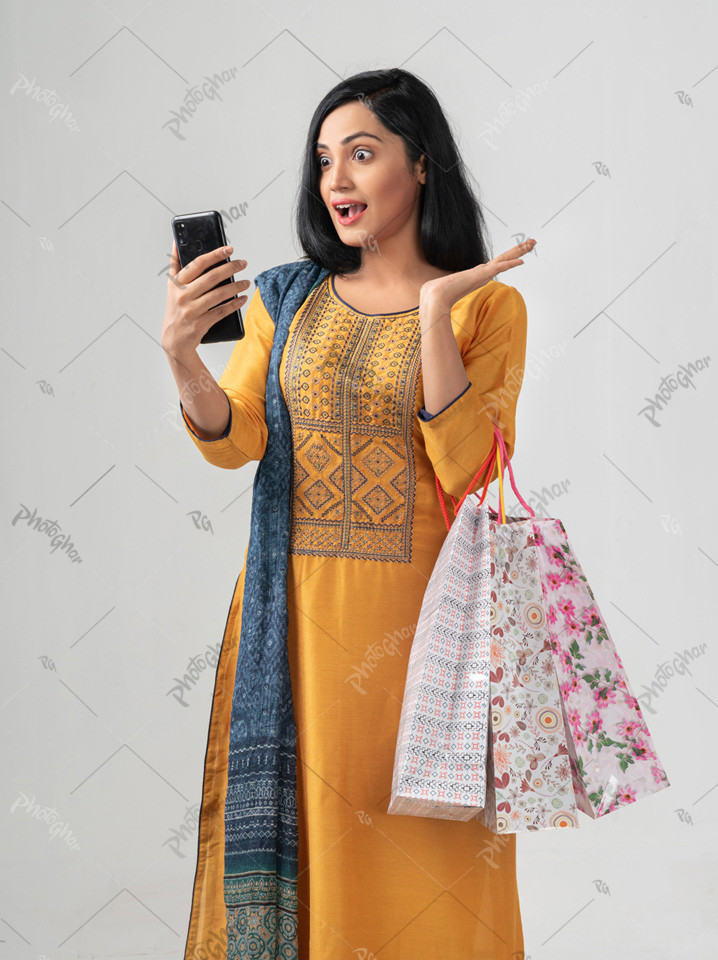 shocked young woman looking phone screen