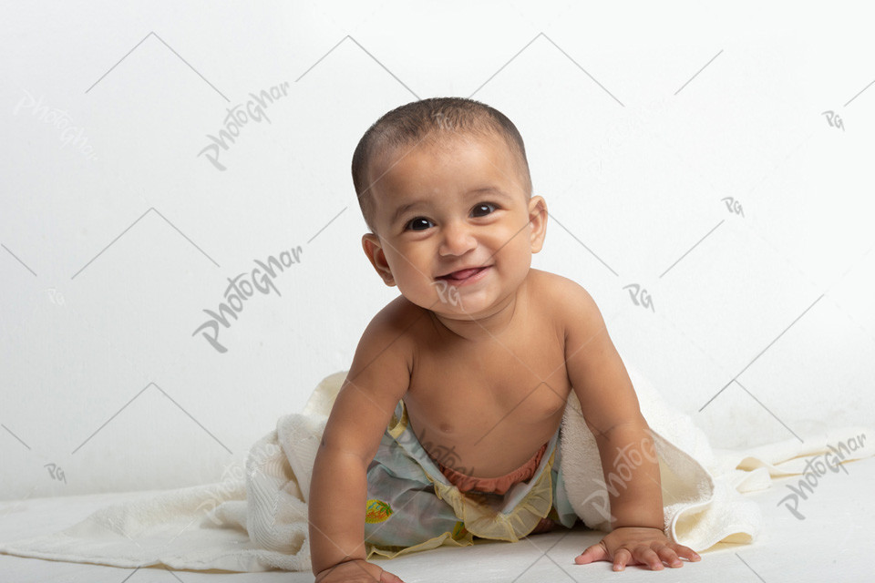 smiling baby crawling