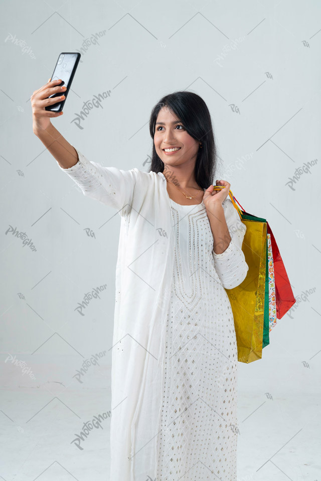 smiling beautiful woman holding shopping bags