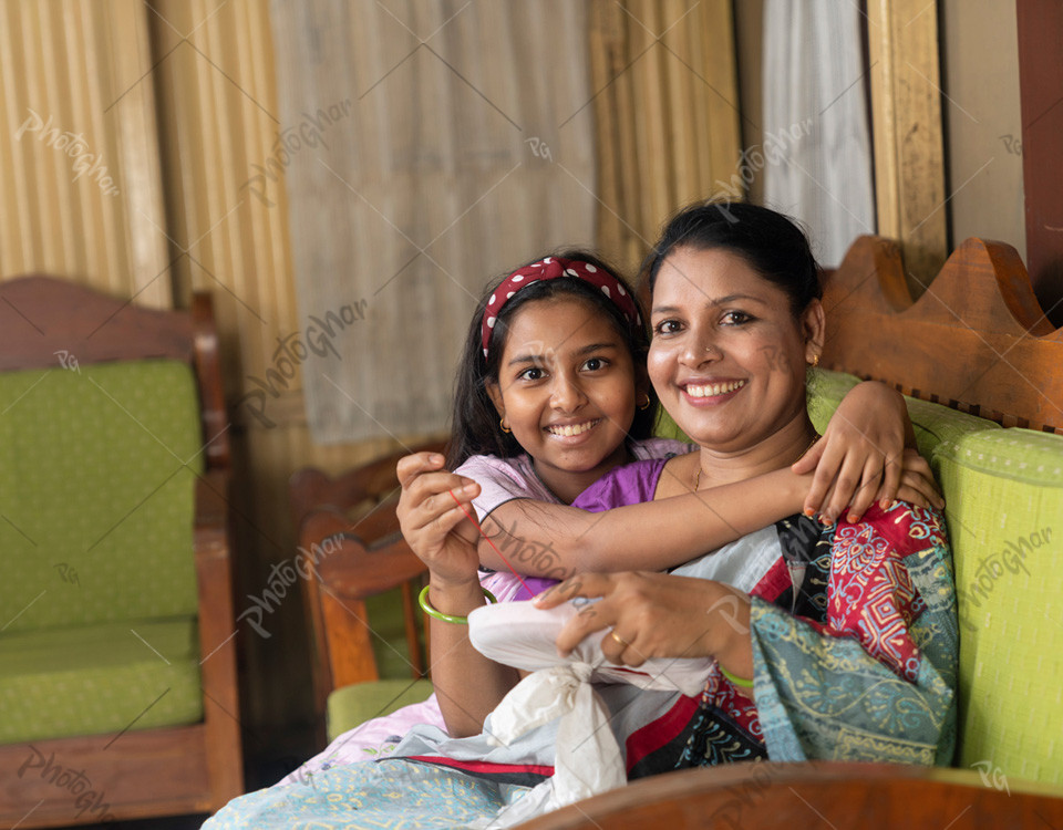 smiling mother daughter make handmade cloth