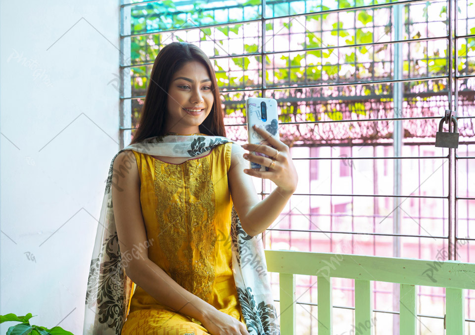 smiling young woman talking on video call