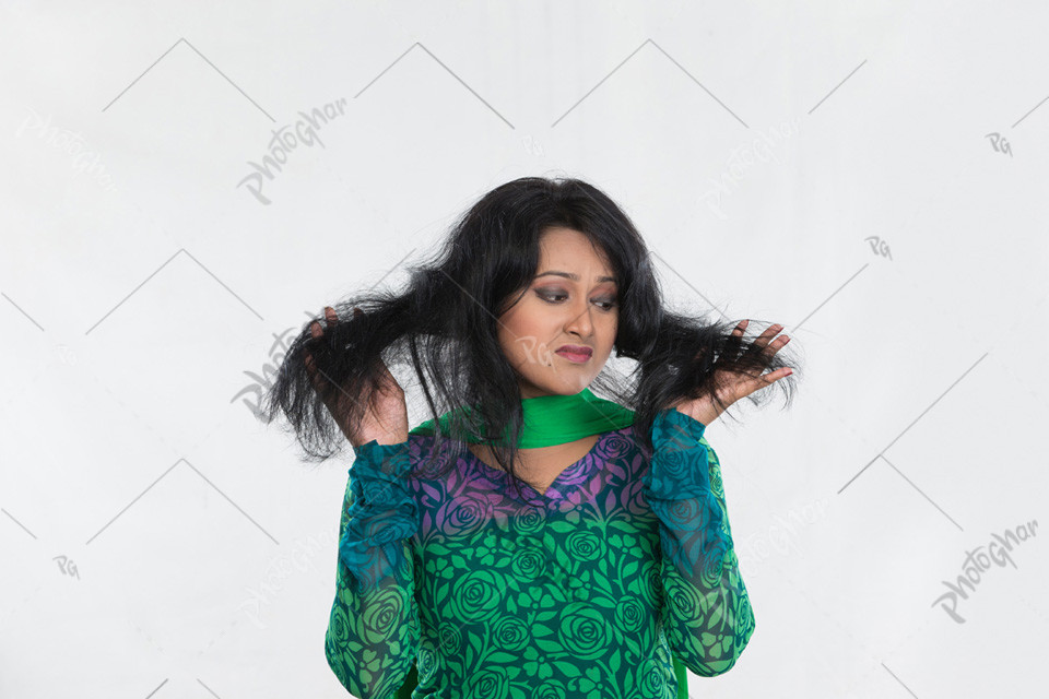 south asian woman worried about weak hair