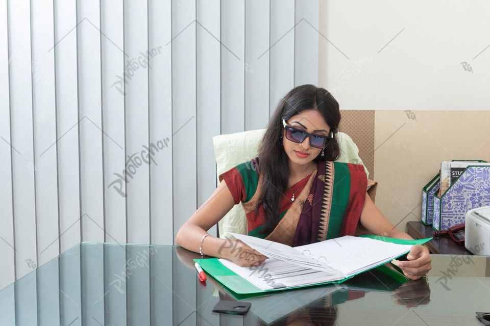 successful female businesswoman sitting workstation