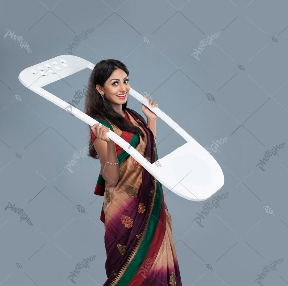 woman holding cut out of mobile icon