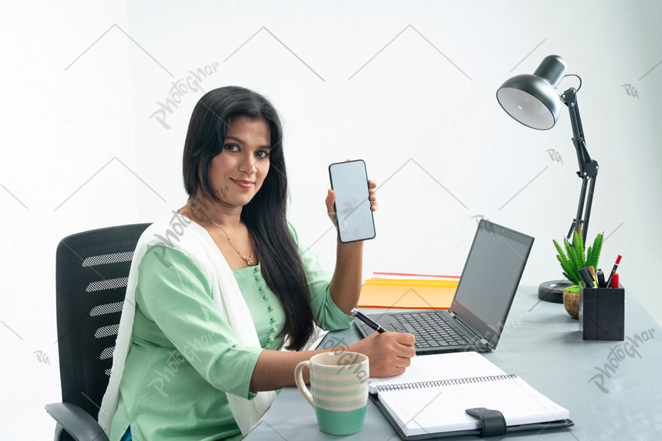 young businesswoman showing screen