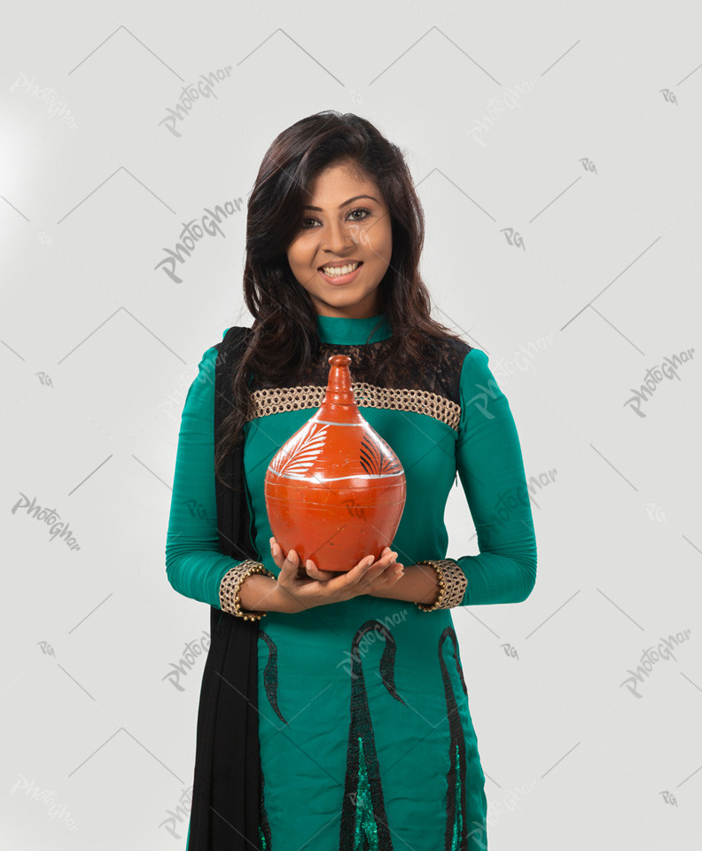 young girl holding clay bank